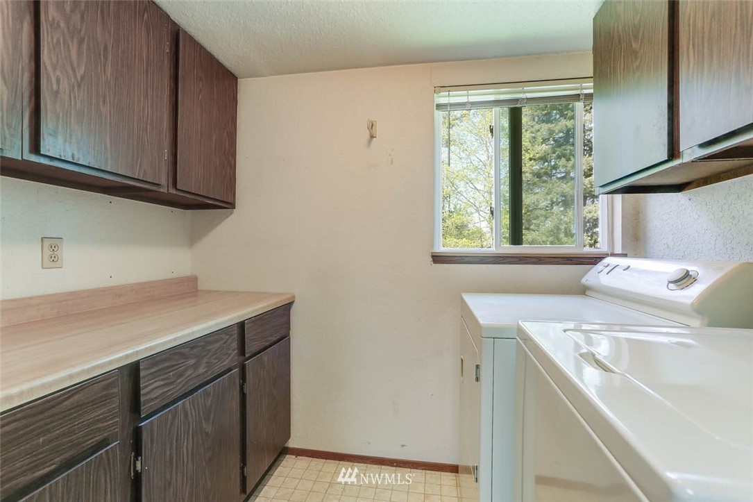 14401 Southeast Petrovitsky Road, Unit F203 Renton, WA 98058 - Photo 8 of 16 a utility room with a sink washer and dryer