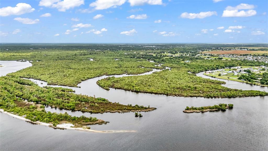 Southwest Sunnybreeze Road Arcadia, FL 34269 - Photo 11 of 50 a view of a lake with a nearby beach