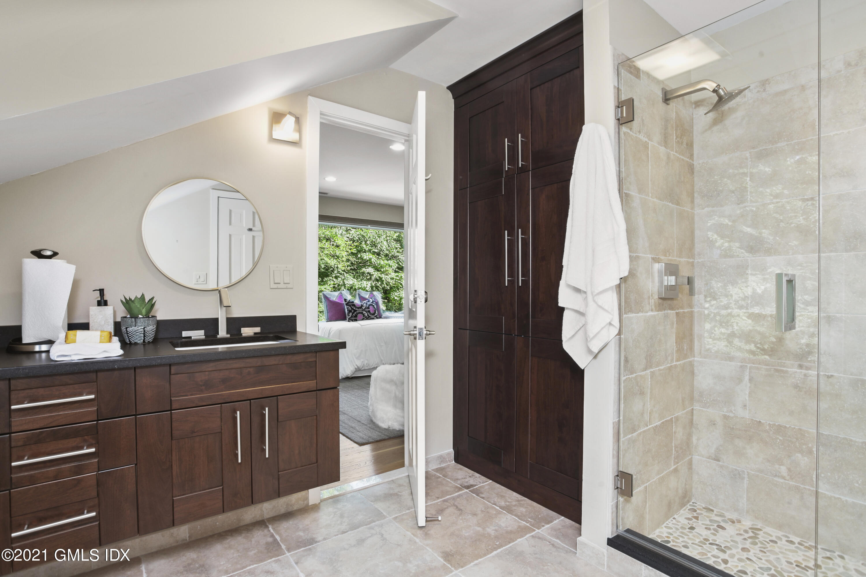 150 Porchuck Road Greenwich, CT 06831 - Photo 17 of 21 a bathroom with a double vanity sink mirror and shower