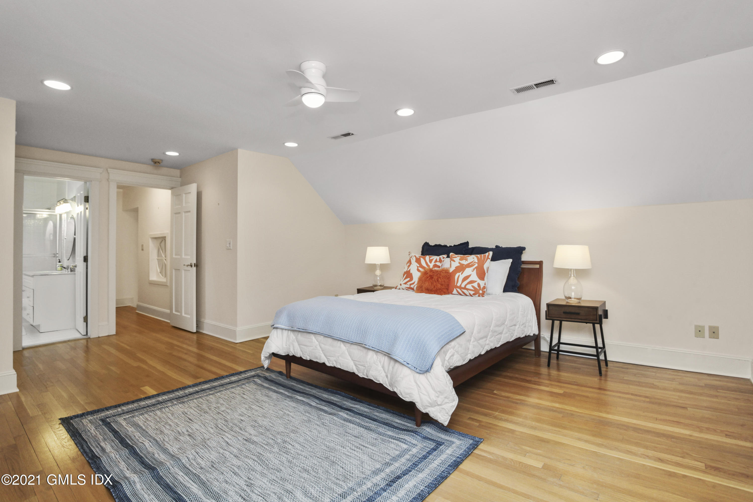 150 Porchuck Road Greenwich, CT 06831 - Photo 18 of 21 a spacious bedroom with a bed and a table