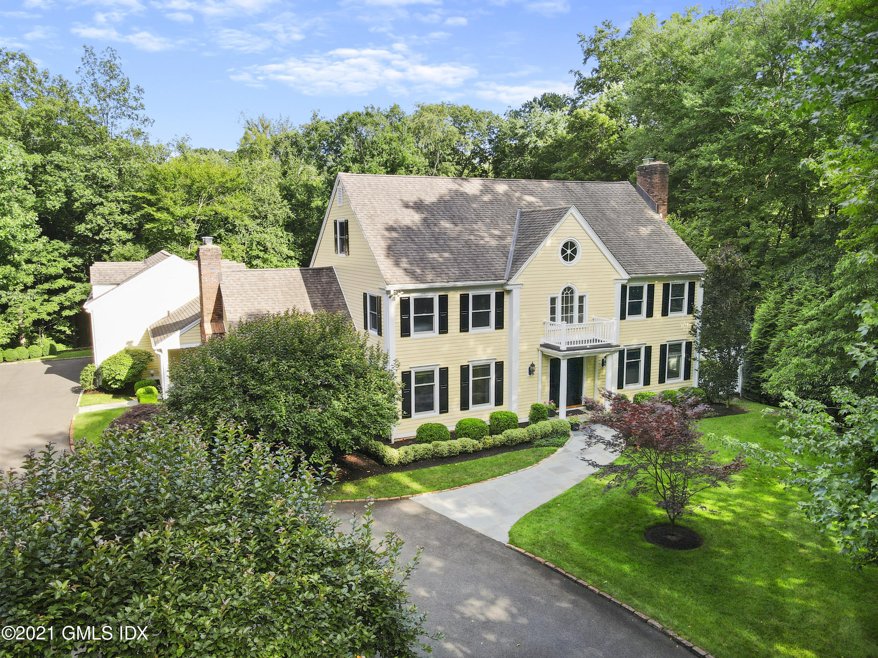 150 Porchuck Road Greenwich, CT 06831 - Photo 3 of 21 front view of a house with a yard