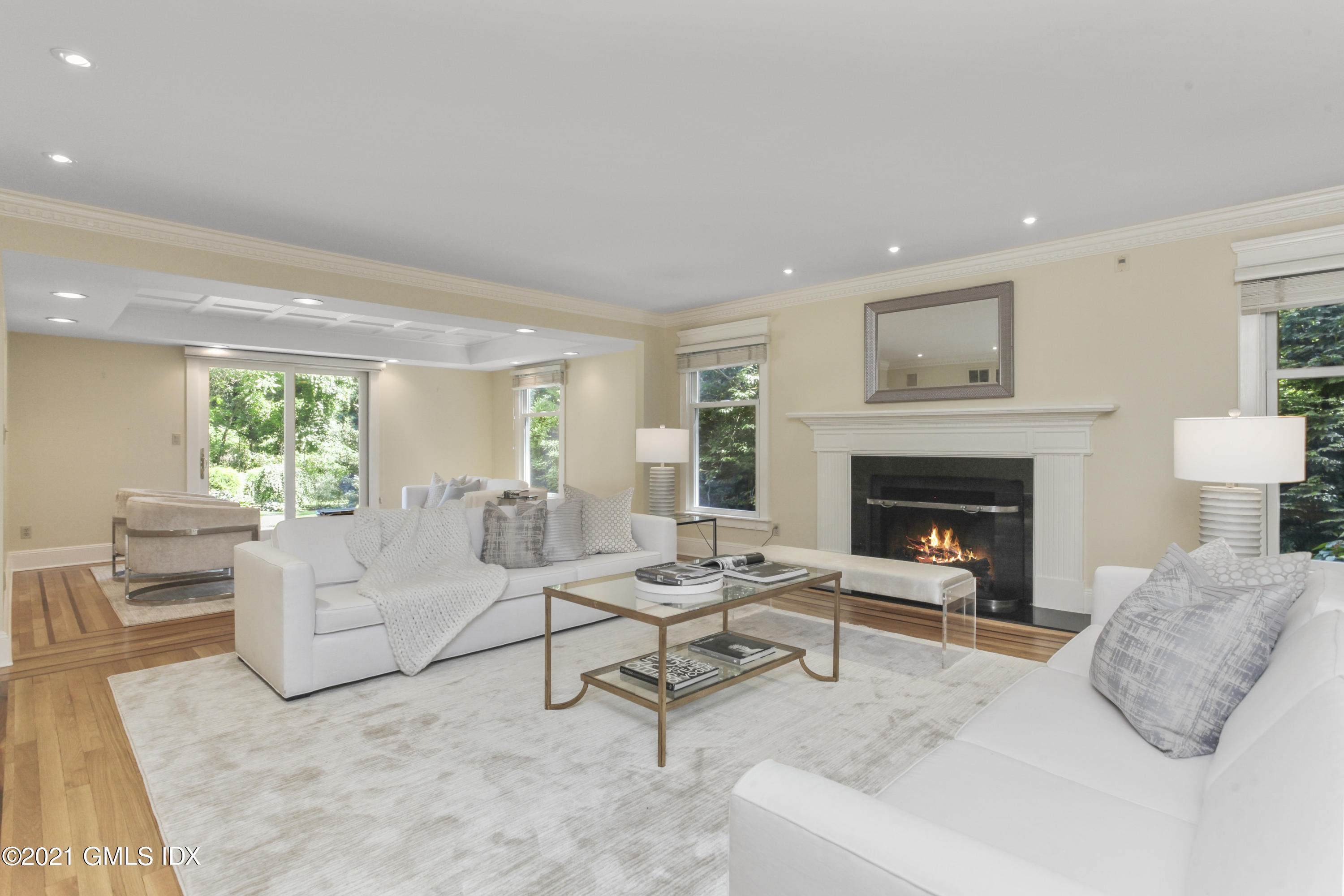 150 Porchuck Road Greenwich, CT 06831 - Photo 5 of 21 a living room with furniture and a fireplace
