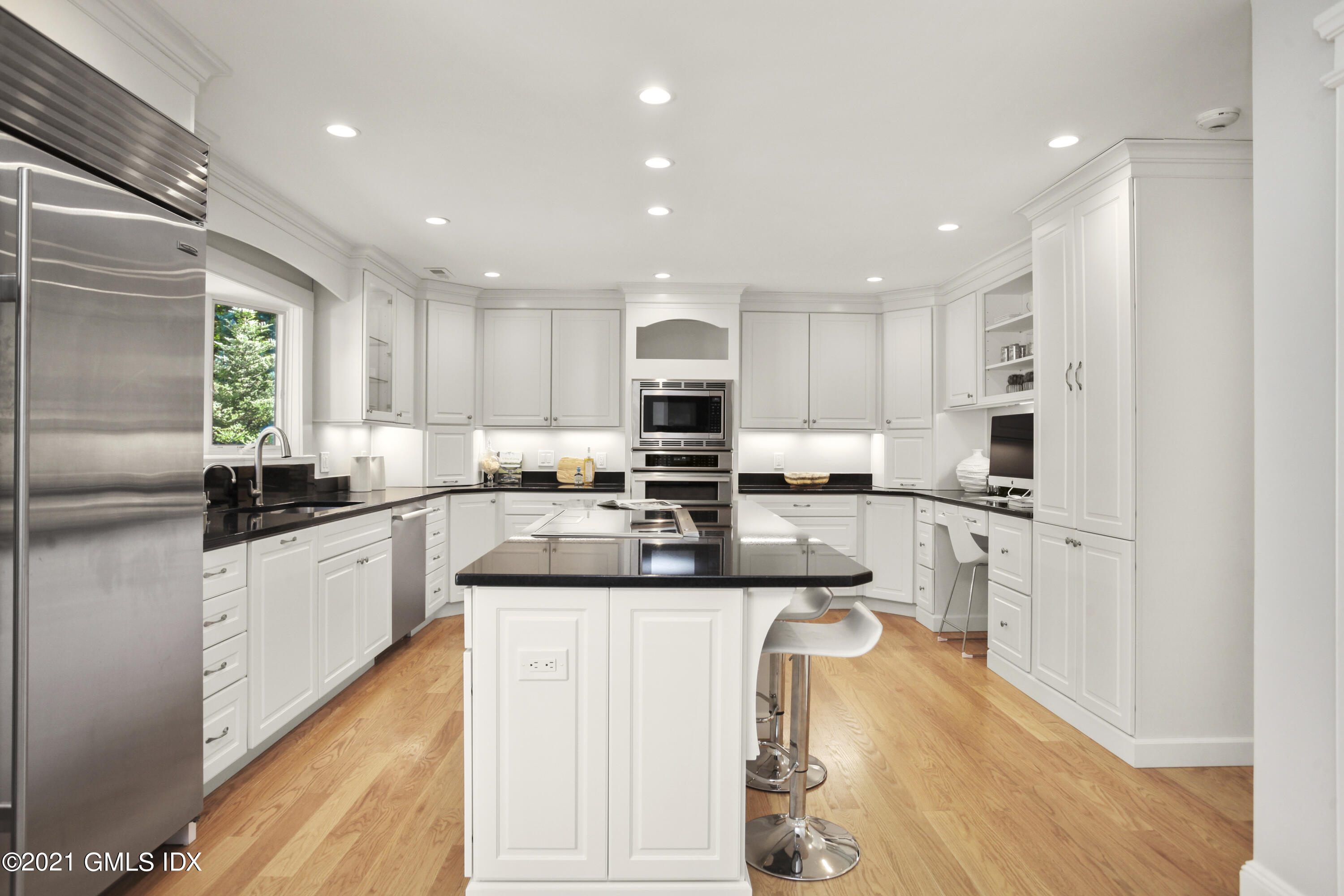 150 Porchuck Road Greenwich, CT 06831 - Photo 8 of 21 a large kitchen with stainless steel appliances granite countertop a stove a sink and a refrigerator