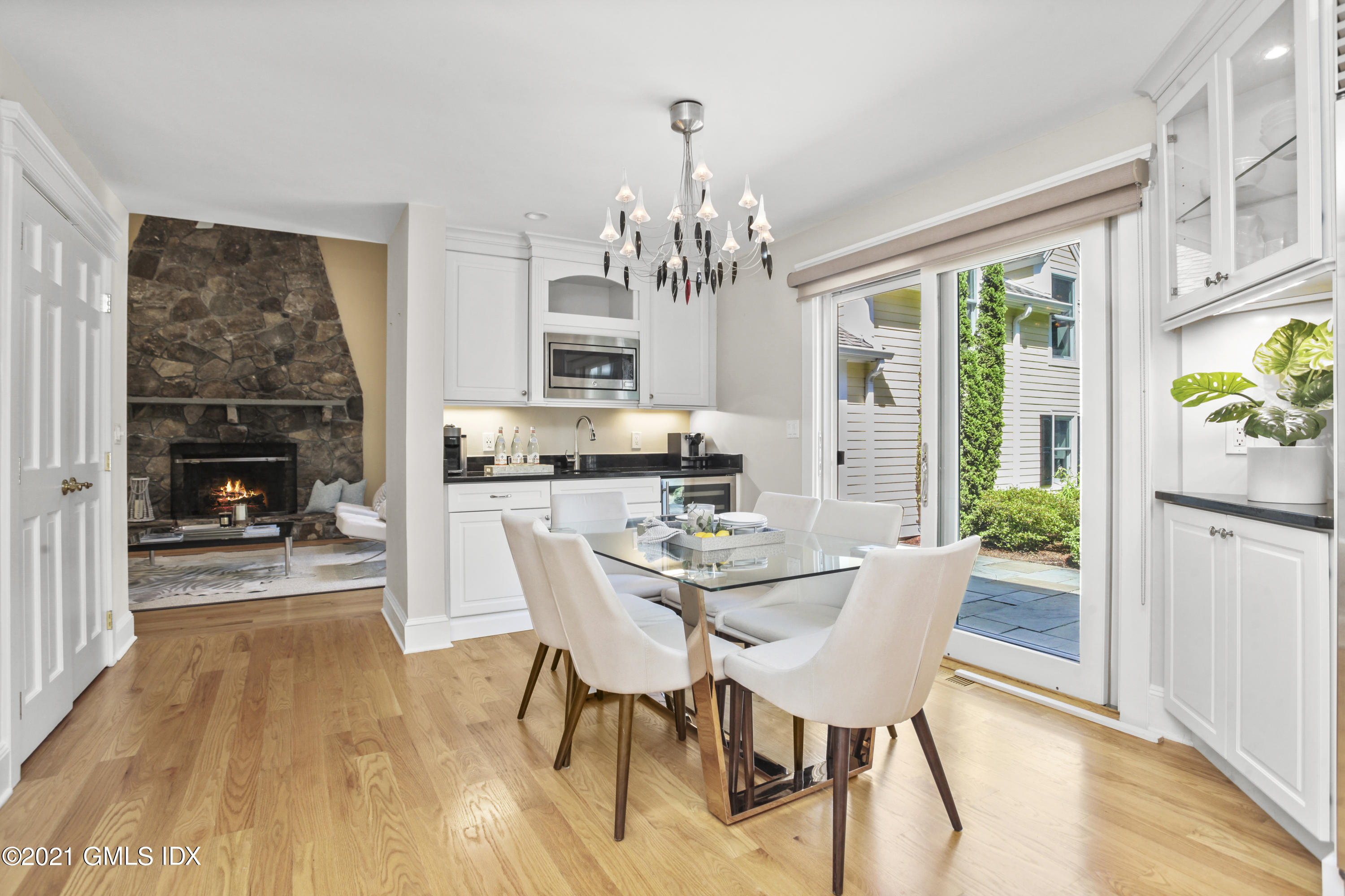 150 Porchuck Road Greenwich, CT 06831 - Photo 9 of 21 a view of a dining room with furniture a chandelier and wooden floor