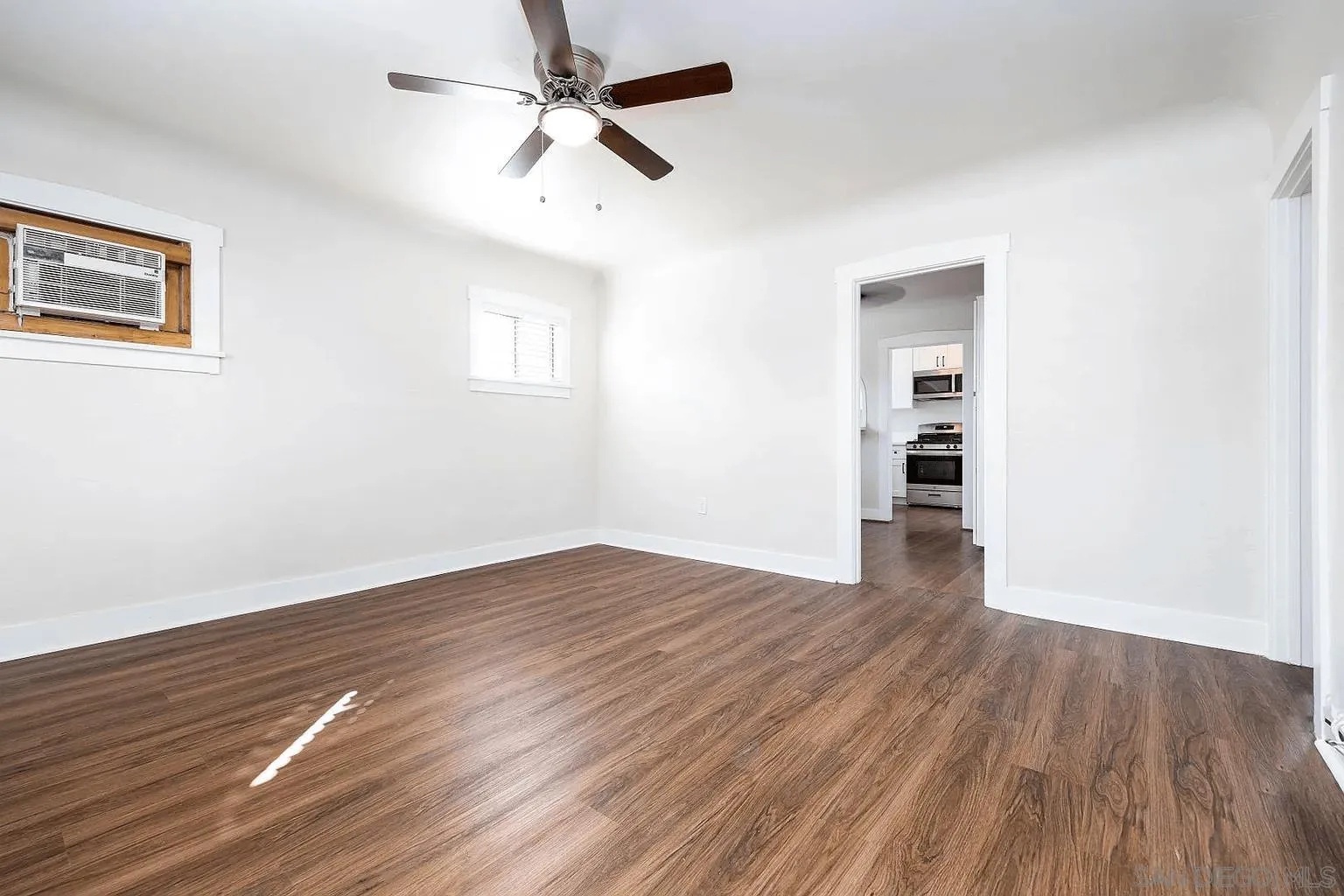 8655 Valencia Street Spring Valley, CA 91977 - Photo 6 of 14 a view of empty room with wooden floor