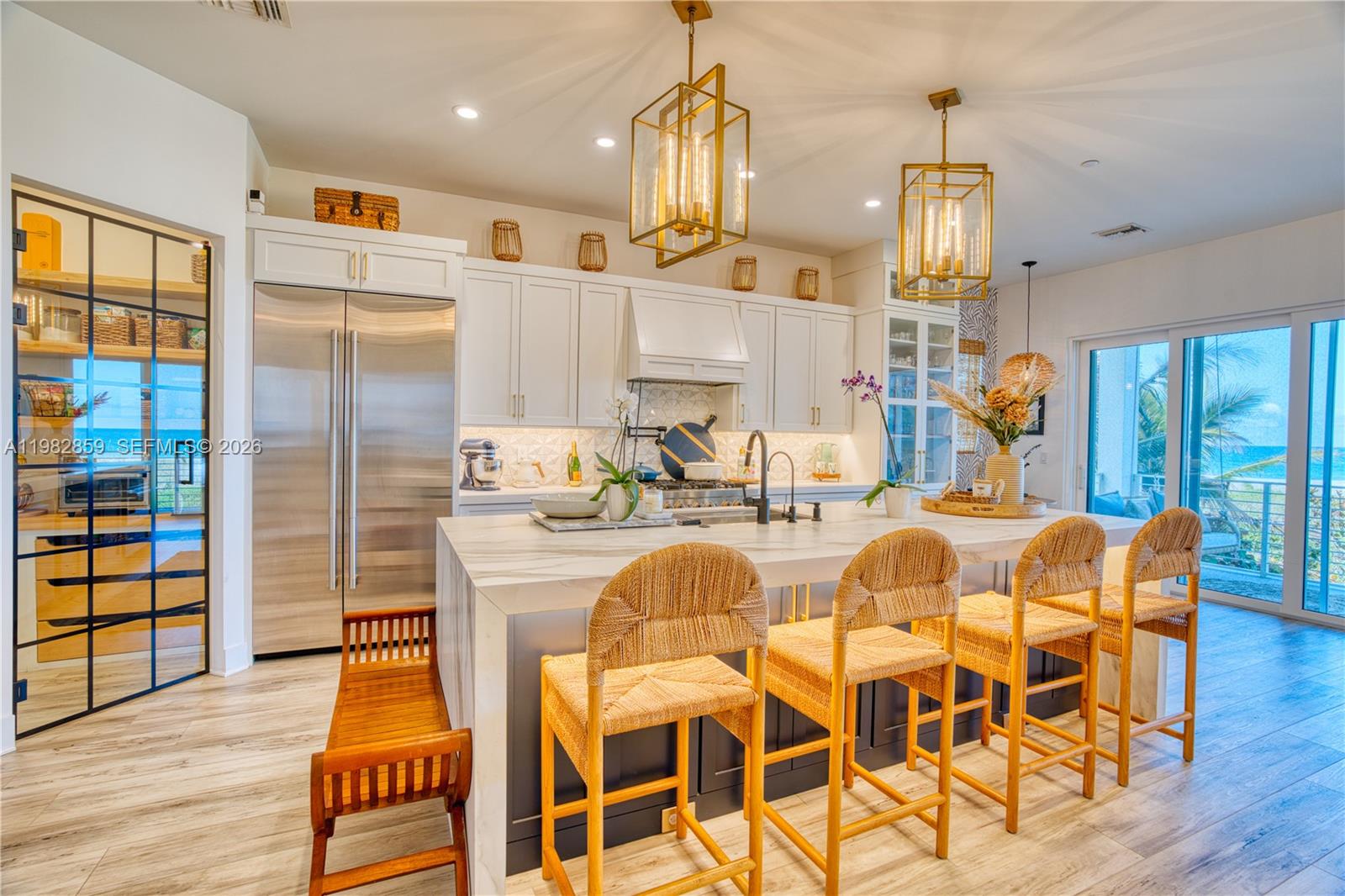 5120 Watersong Way Fort Pierce, FL 34949 - Photo 14 of 70 a large kitchen with a table and chairs