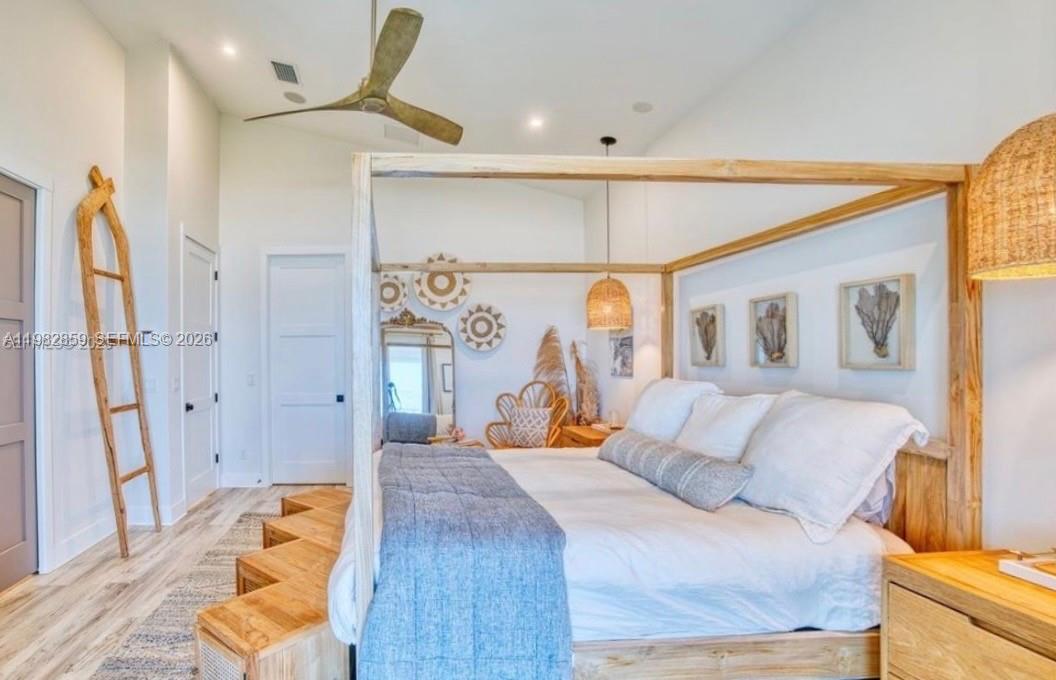 5120 Watersong Way Fort Pierce, FL 34949 - Photo 29 of 70 a bedroom with a bed and a painting on the wall