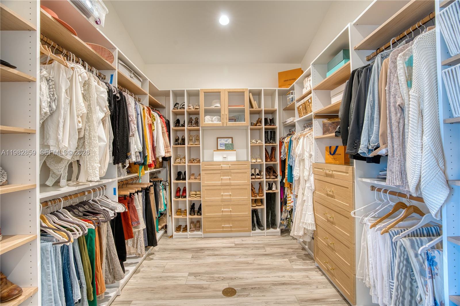 5120 Watersong Way Fort Pierce, FL 34949 - Photo 30 of 70 a view of walk in closet with clothes and shoes
