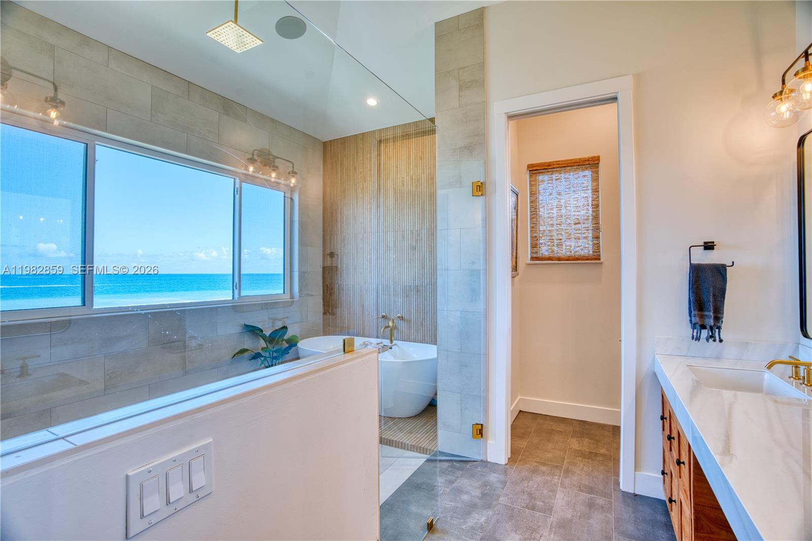 5120 Watersong Way Fort Pierce, FL 34949 - Photo 31 of 70 a bathroom with a tub and sink