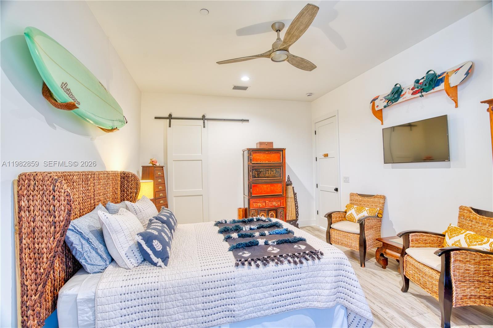 5120 Watersong Way Fort Pierce, FL 34949 - Photo 36 of 70 a bedroom with a bed and wooden floor