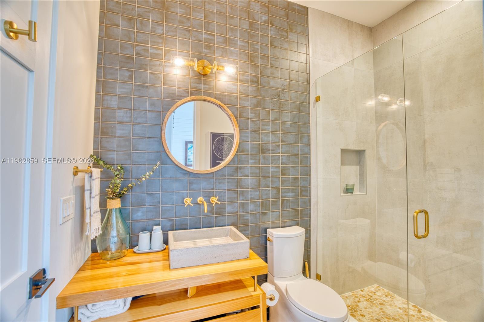 5120 Watersong Way Fort Pierce, FL 34949 - Photo 46 of 70 a bathroom with a sink and a mirror