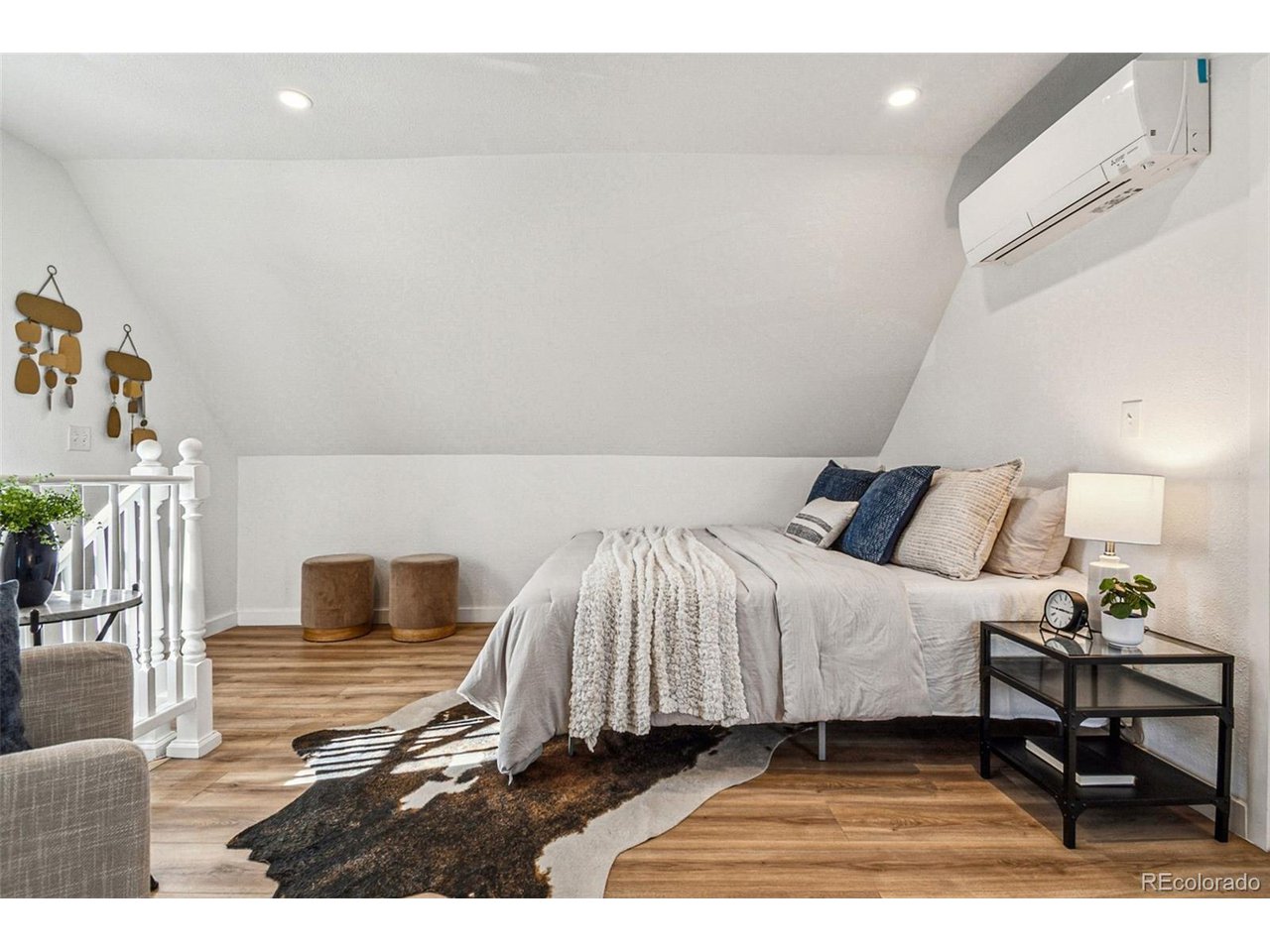 20 South Sherman Street Denver, CO 80209 - Photo 13 of 36 a bedroom with a bed and wooden floor