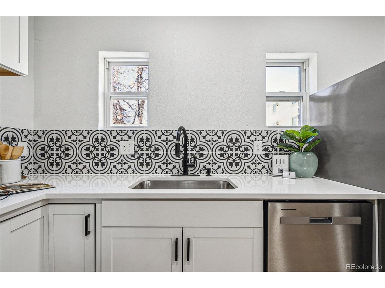 20 South Sherman Street Denver, CO 80209 - Photo 8 of 36 a view of kitchen with a sink and wooden cabinets