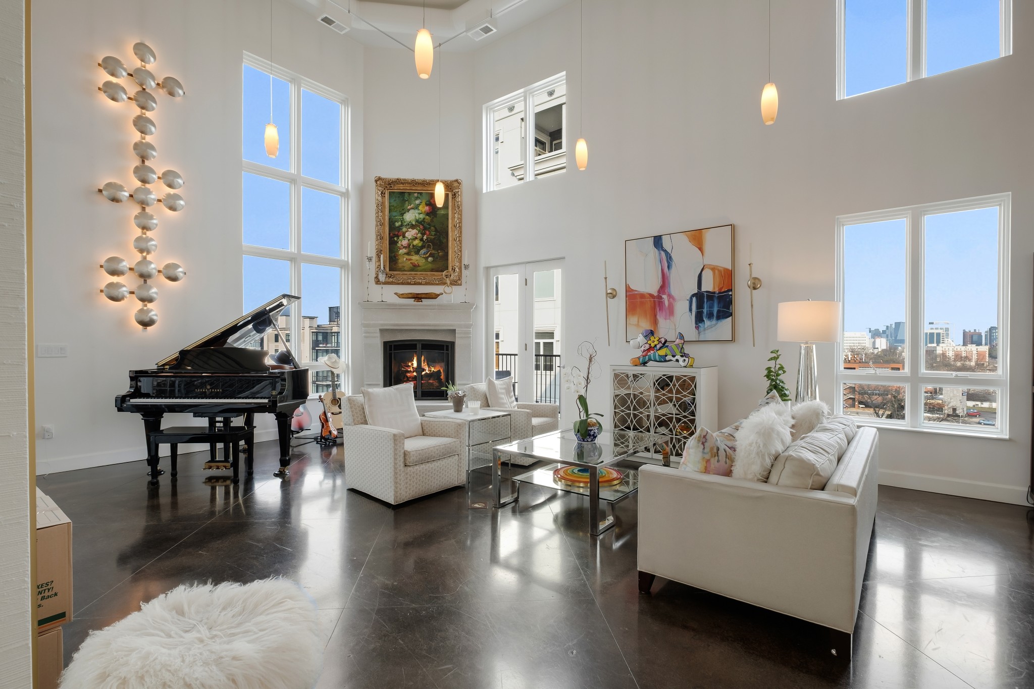 a living room with fireplace furniture and a wooden floor