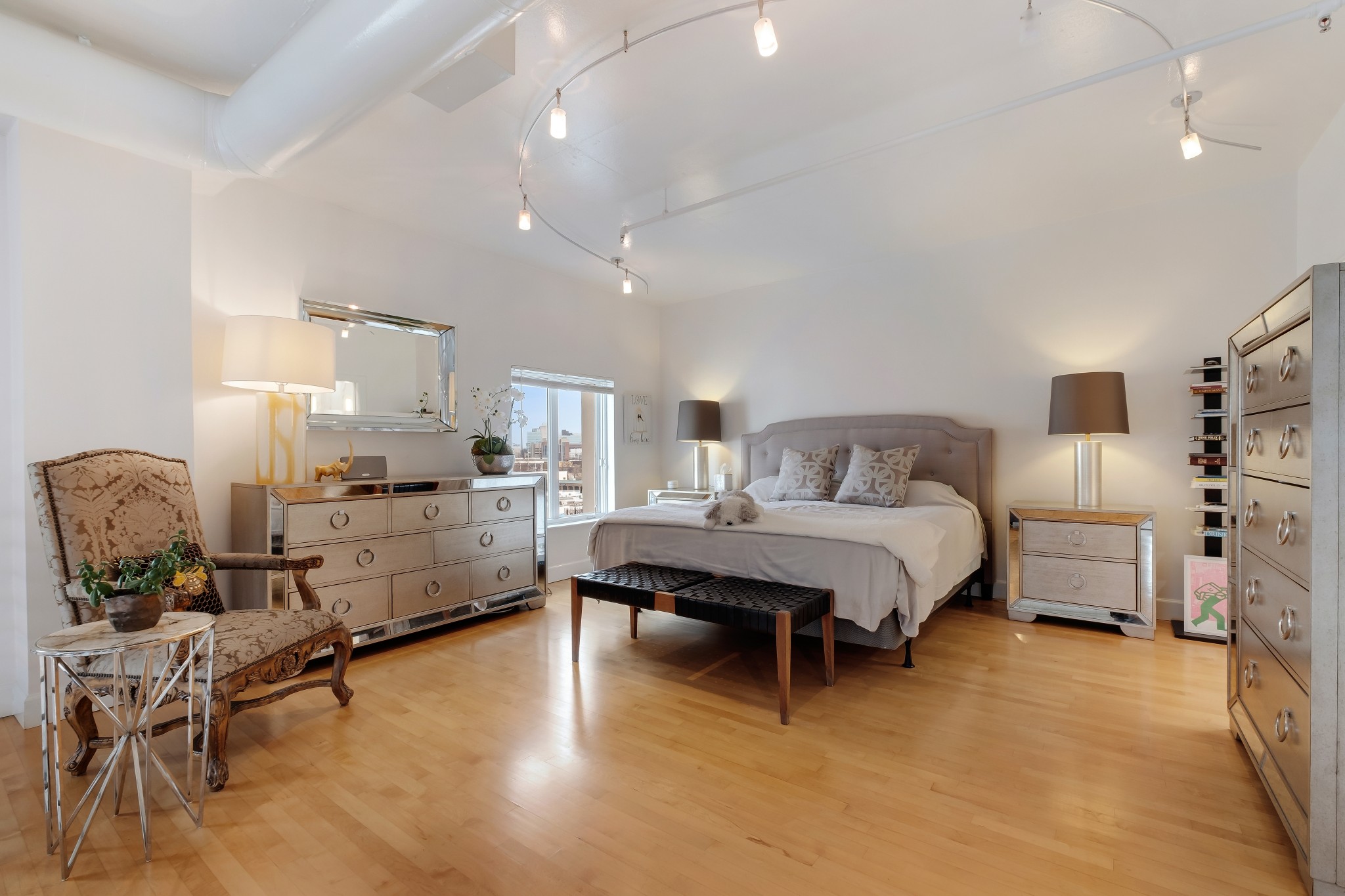 3014 Hedrick Street, Unit 504 Nashville, TN 37203 - Photo 25 of 33 a bedroom with furniture and a wooden floor