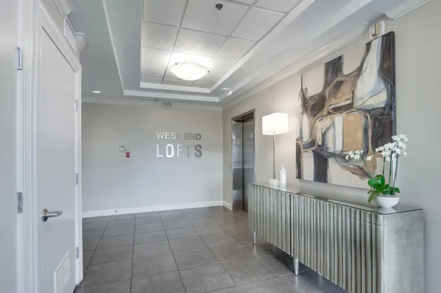 a view of a hallway with entryway to windows