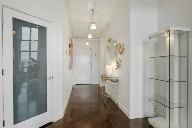 a bathroom with a shower and a glass door