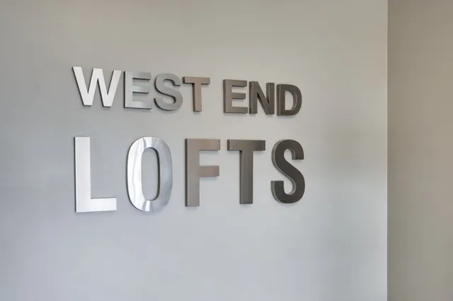 a bathroom with a bathtub and mirror on it