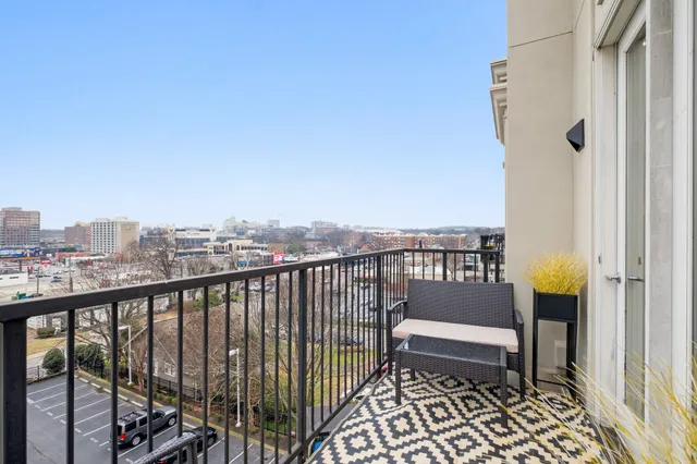 a view of a balcony with wooden floor