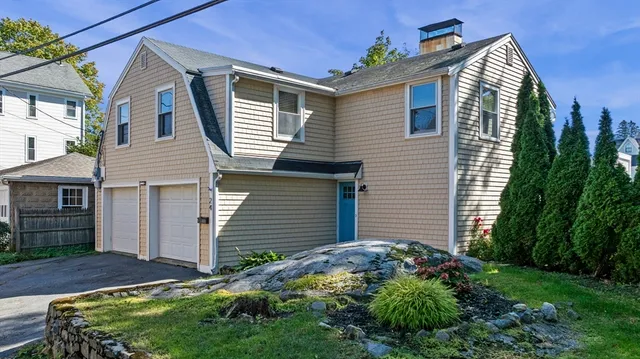 a front view of house with yard and green space