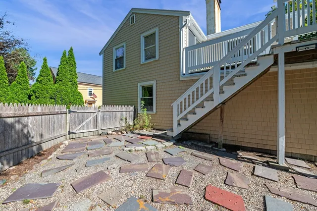 a view of a house with wooden stairs