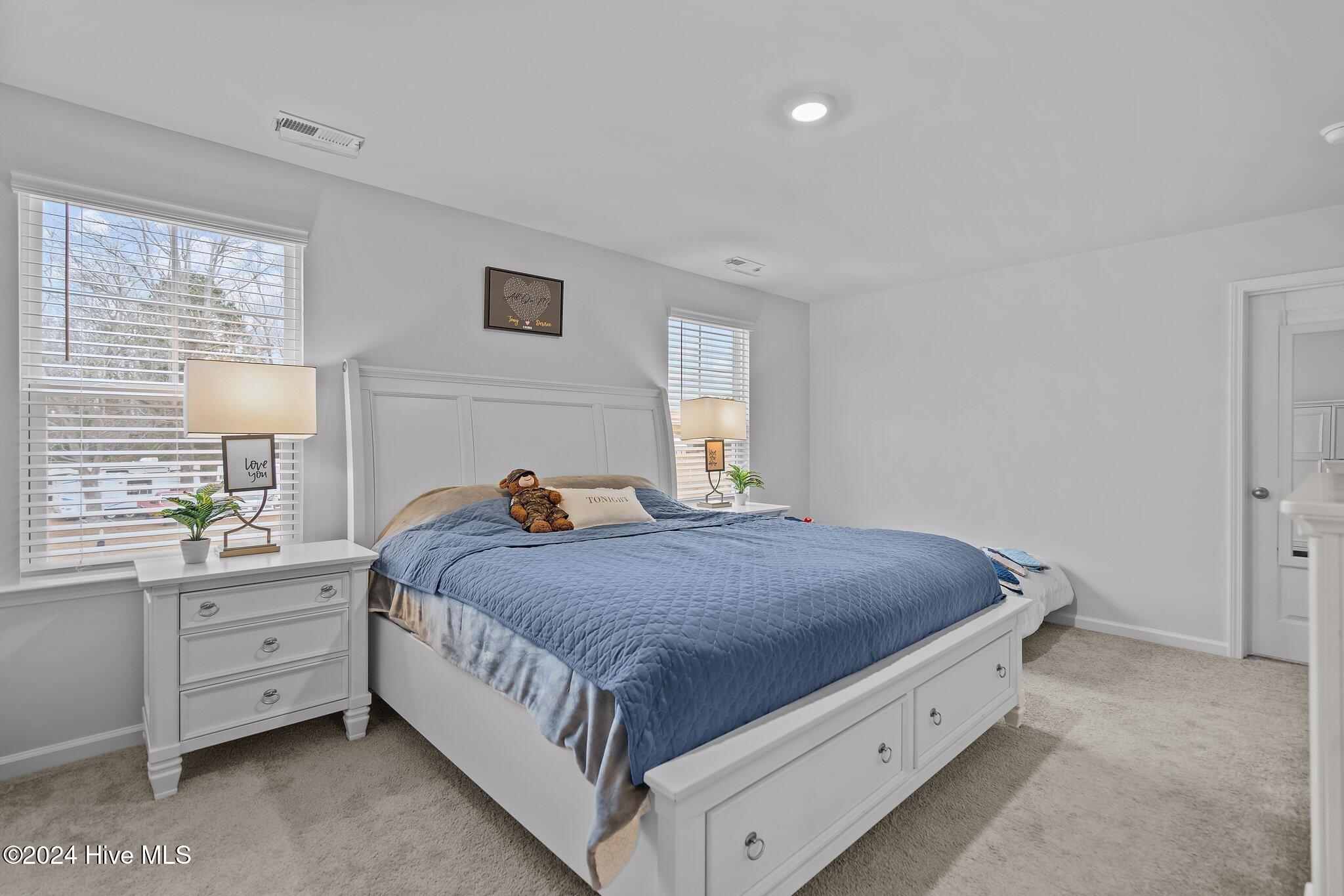 402 Folkstone Road, Unit LOT 71 Holly Ridge, NC 28445 - Photo 28 of 39 Primary Bedroom