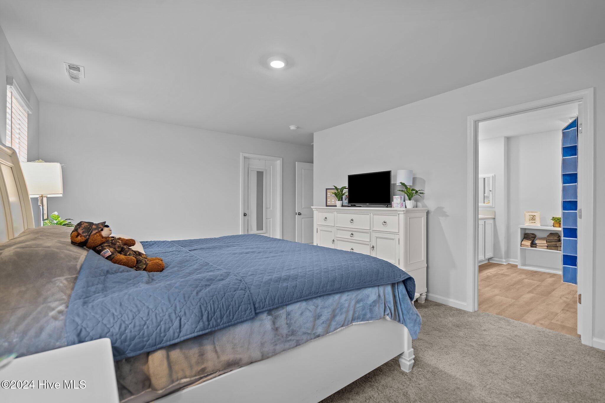 402 Folkstone Road, Unit LOT 71 Holly Ridge, NC 28445 - Photo 29 of 39 Primary Bedroom