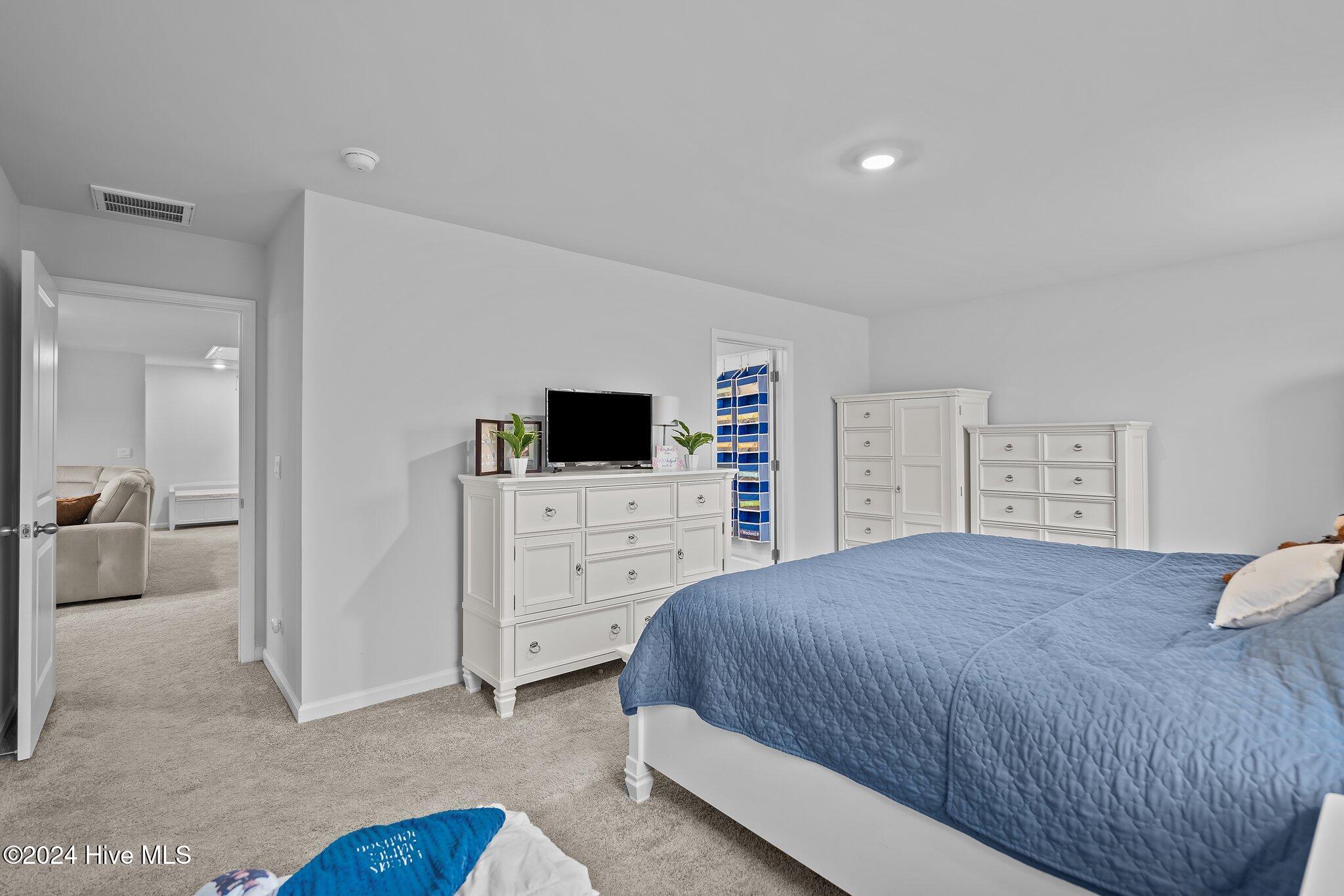 402 Folkstone Road, Unit LOT 71 Holly Ridge, NC 28445 - Photo 30 of 39 Primary Bedroom