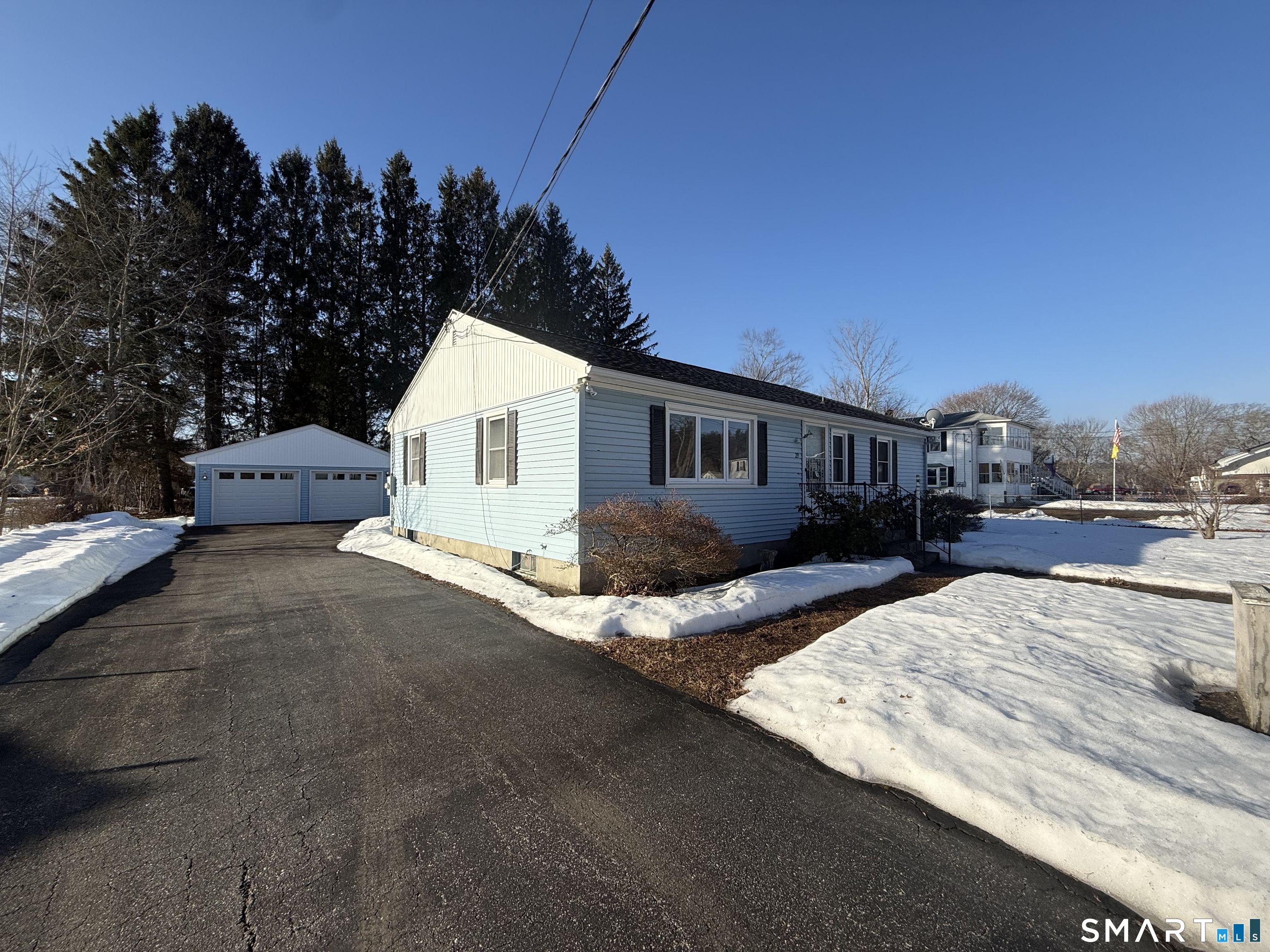 a view of house with outdoor space and sitting area