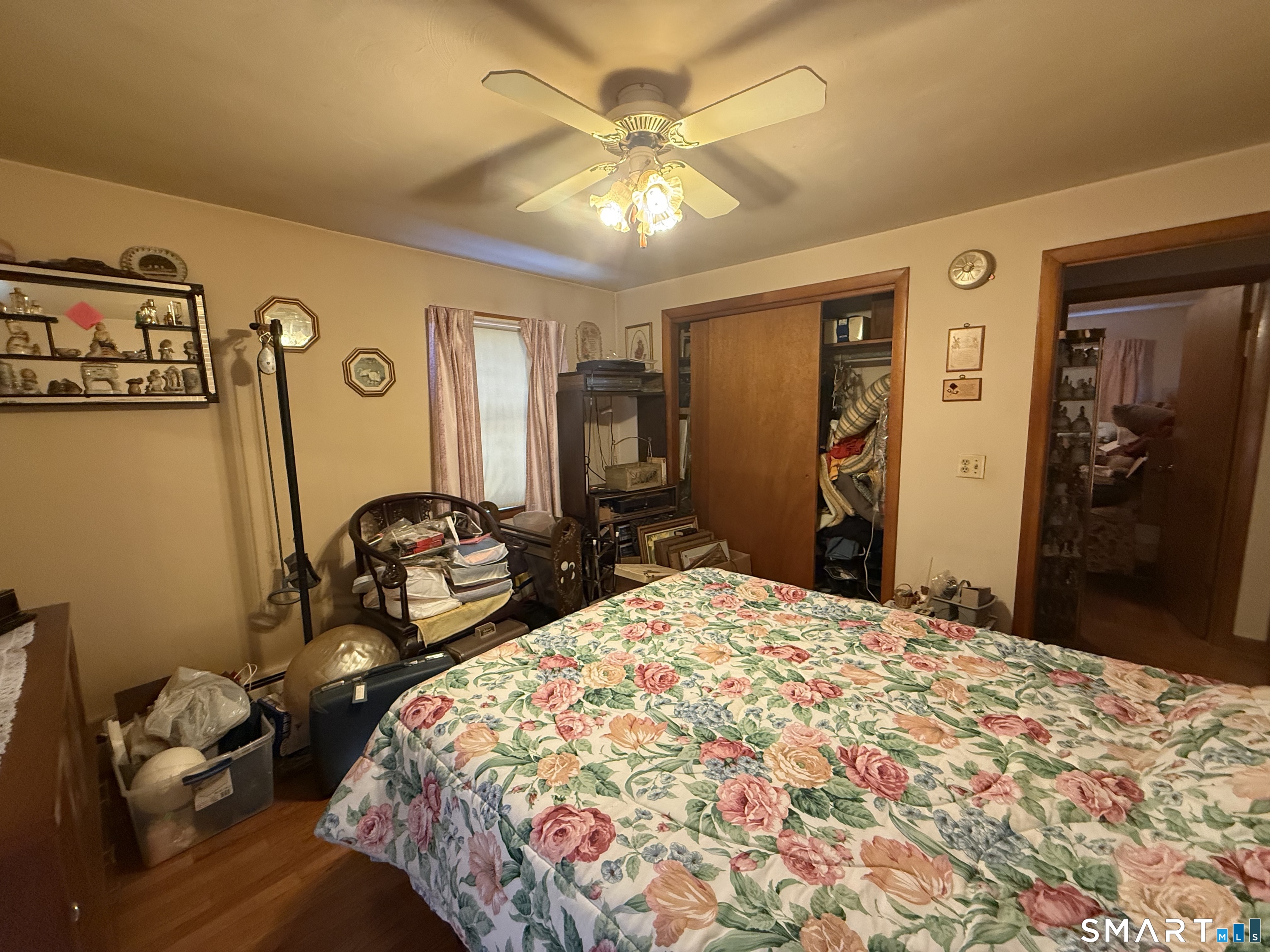 29 Rosedale Street Killingly, CT 06239 - Photo 16 of 23 a bedroom with a bed and a chandelier