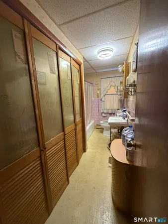 a bathroom with a sink a mirror and shower