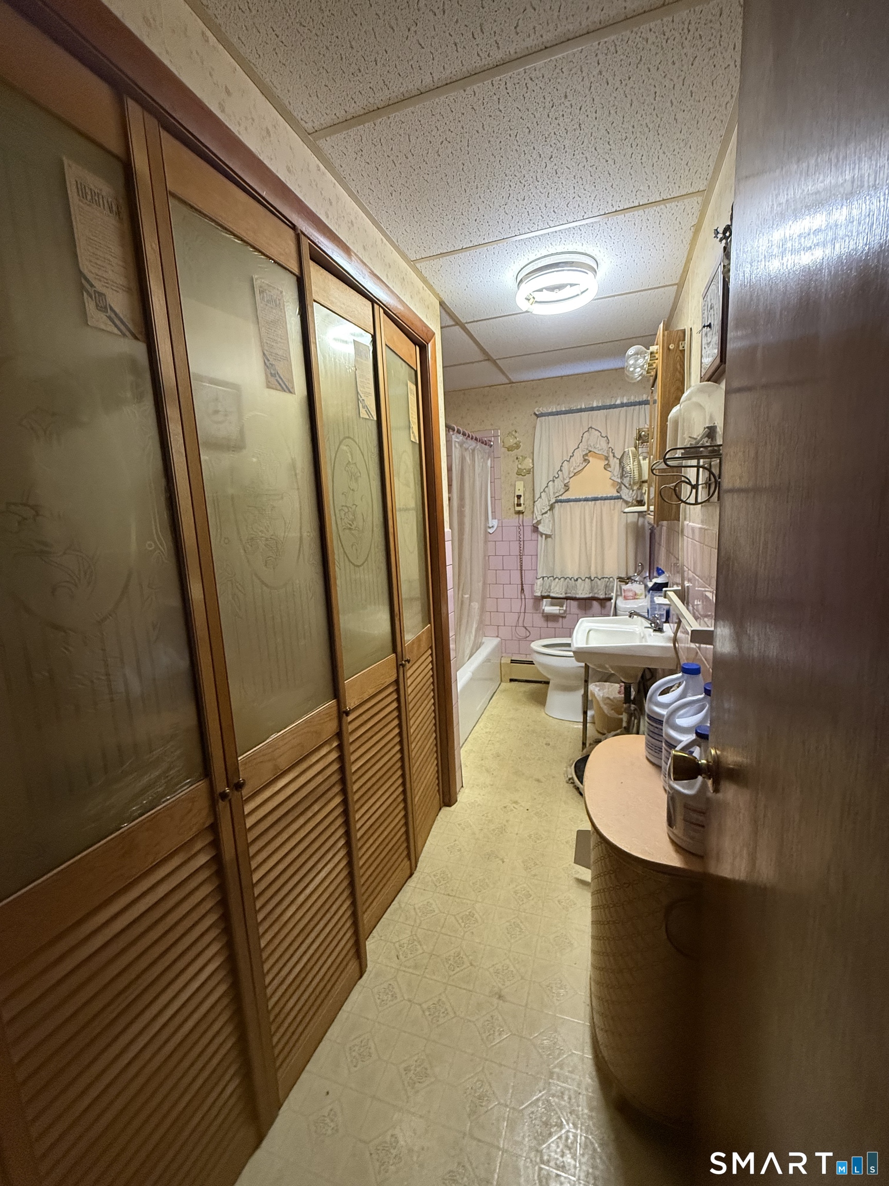 29 Rosedale Street Killingly, CT 06239 - Photo 19 of 23 a bathroom with a sink a mirror and shower