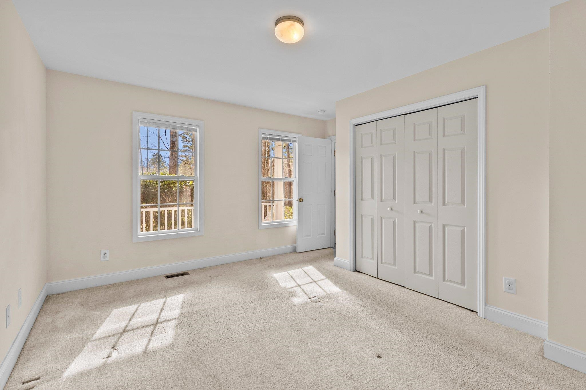 6041 Burgundy Road Durham, NC 27712 - Photo 17 of 45 an empty room with windows