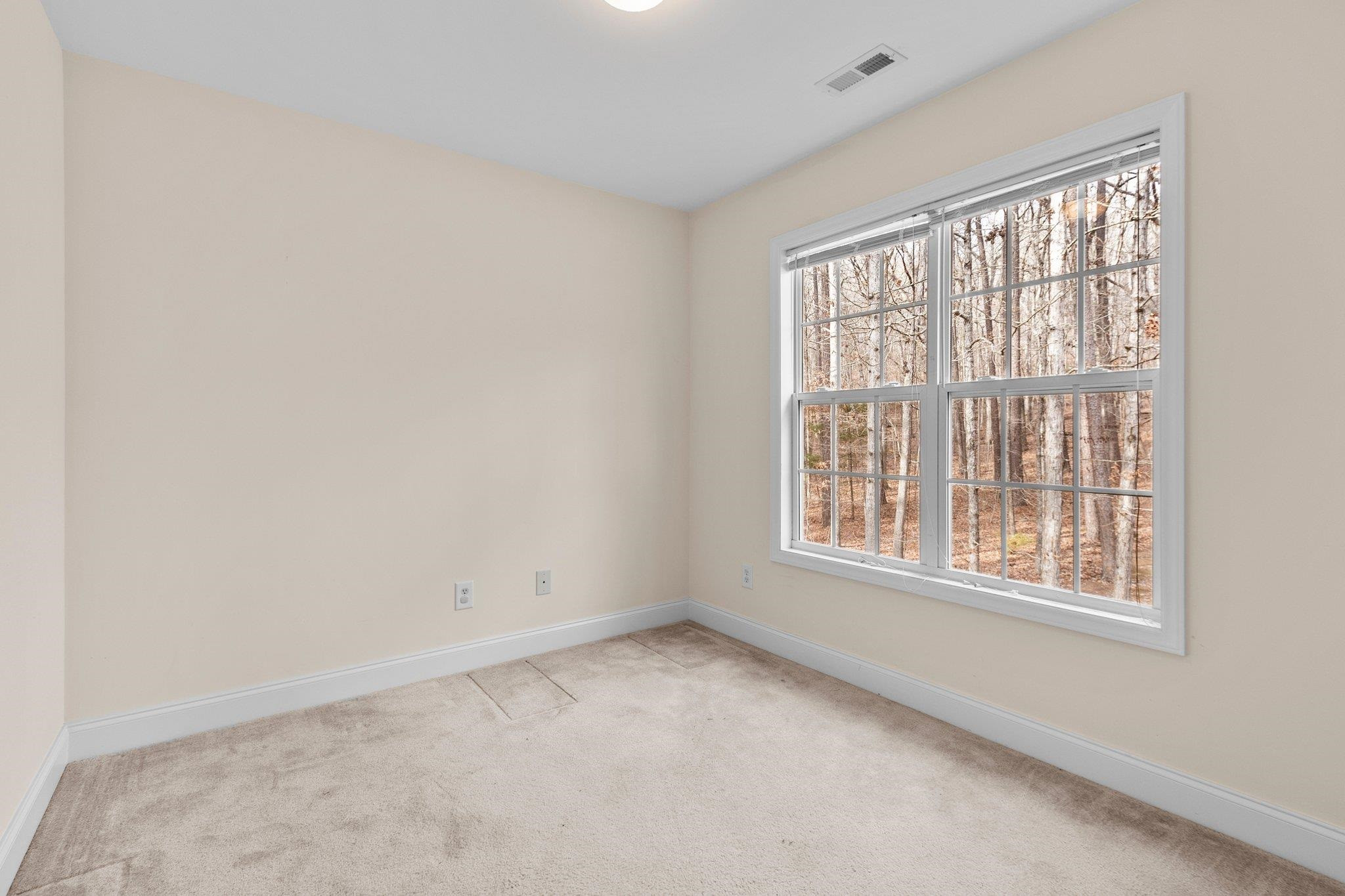 6041 Burgundy Road Durham, NC 27712 - Photo 23 of 45 an empty room with a window