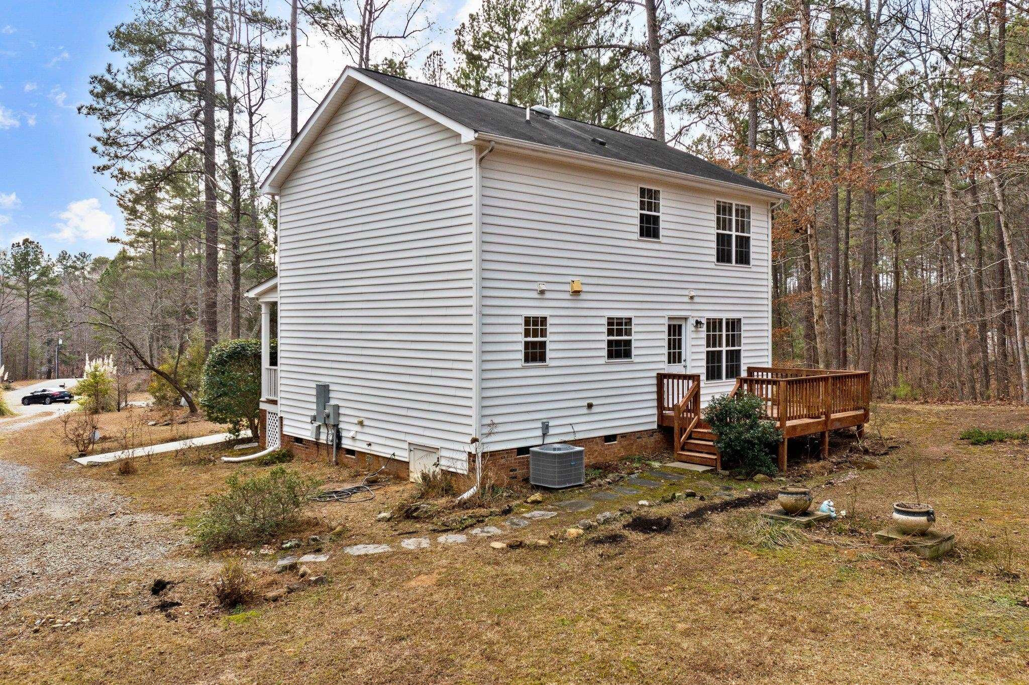 6041 Burgundy Road Durham, NC 27712 - Photo 29 of 45 a view of a house with a yard and sitting area