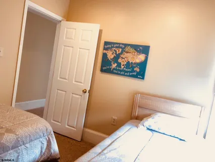 a bedroom with a bed and furniture