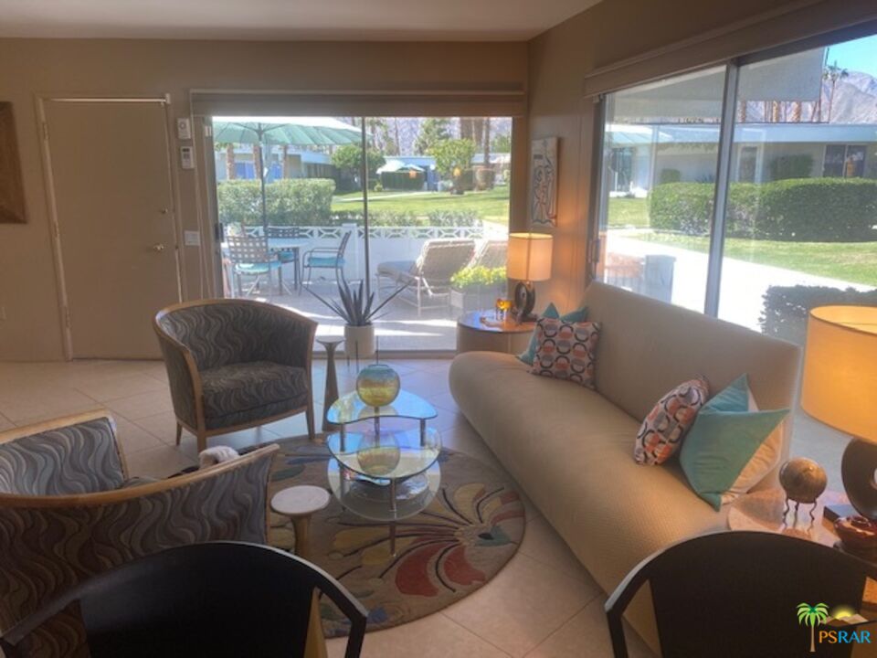 2033 Ramon Road, Unit 4B Palm Springs, CA 92264 - Photo 12 of 44 a living room with furniture and a large window