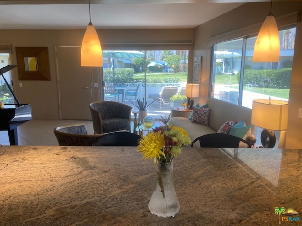 2033 Ramon Road, Unit 4B Palm Springs, CA 92264 - Photo 20 of 44 a living room with furniture and a large window