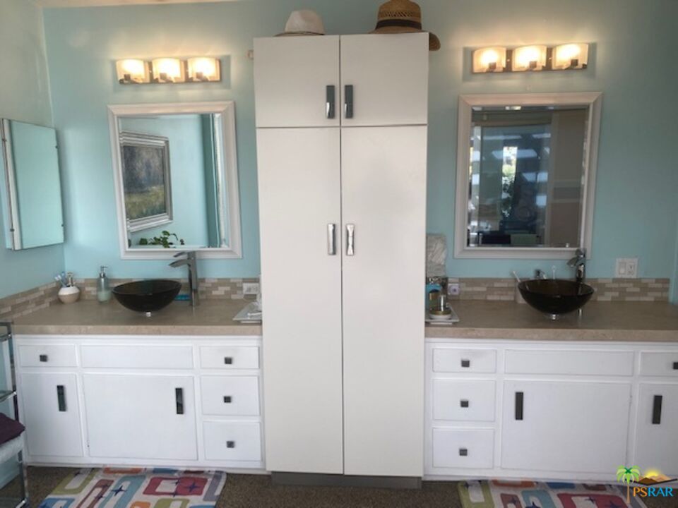 2033 Ramon Road, Unit 4B Palm Springs, CA 92264 - Photo 30 of 44 a bathroom with a sink and a mirror