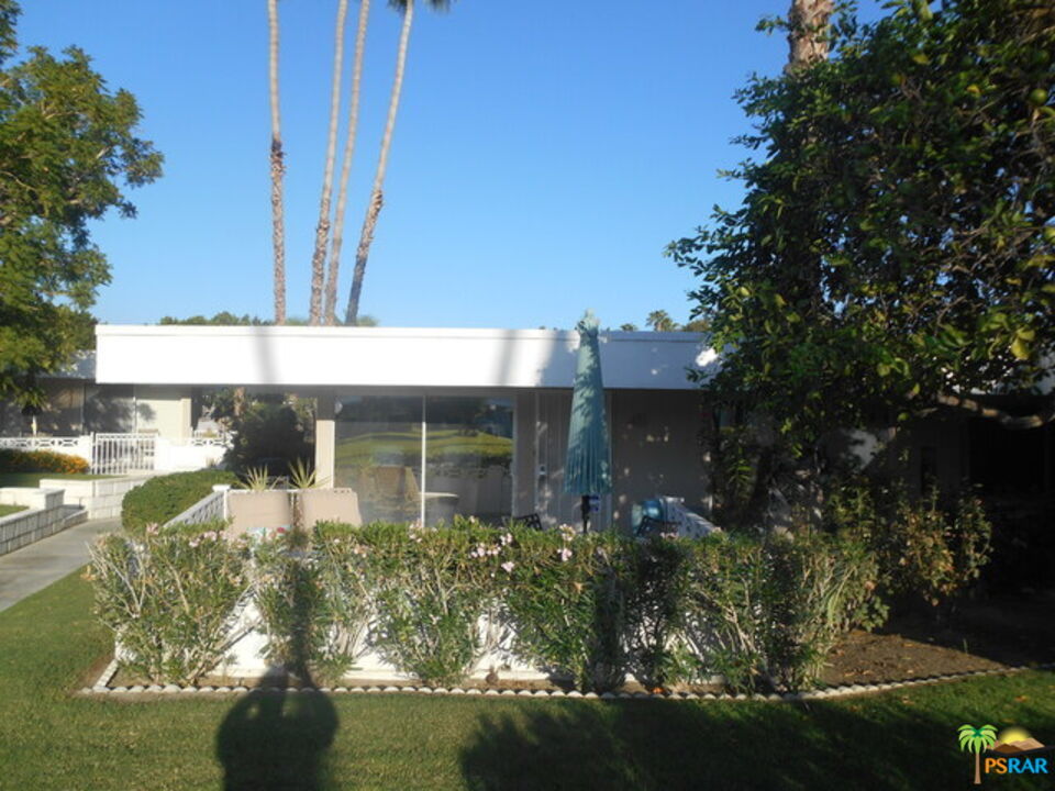 2033 Ramon Road, Unit 4B Palm Springs, CA 92264 - Photo 3 of 44 a front view of a house with garden
