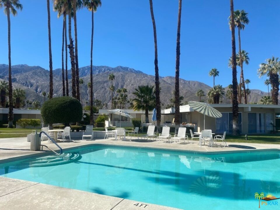 2033 Ramon Road, Unit 4B Palm Springs, CA 92264 - Photo 35 of 44 a house view with a sitting space fire pit and outdoor space