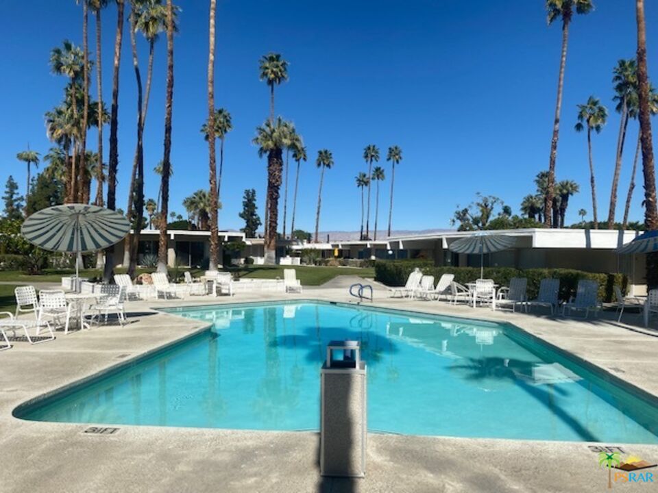 2033 Ramon Road, Unit 4B Palm Springs, CA 92264 - Photo 36 of 44 a view of swimming pool with outdoor seating and a patio