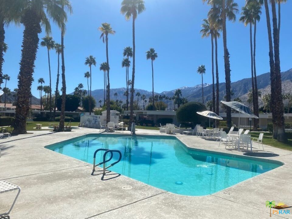 2033 Ramon Road, Unit 4B Palm Springs, CA 92264 - Photo 39 of 44 a view of a swimming pool with chairs