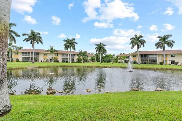 a view of a lake with a house in the background