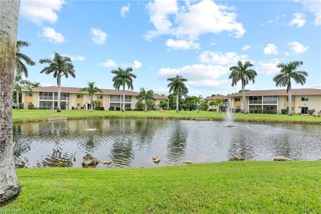 a view of a lake with a house in the background