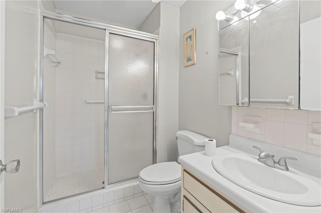 6184 Michelle Way, Unit 243 Fort Myers, FL 33919 - Photo 11 of 21 a bathroom with a sink toilet and shower