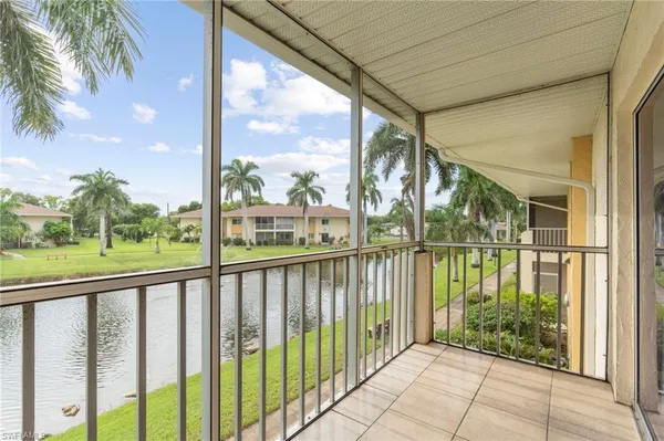 a view of a porch with a floor to ceiling window