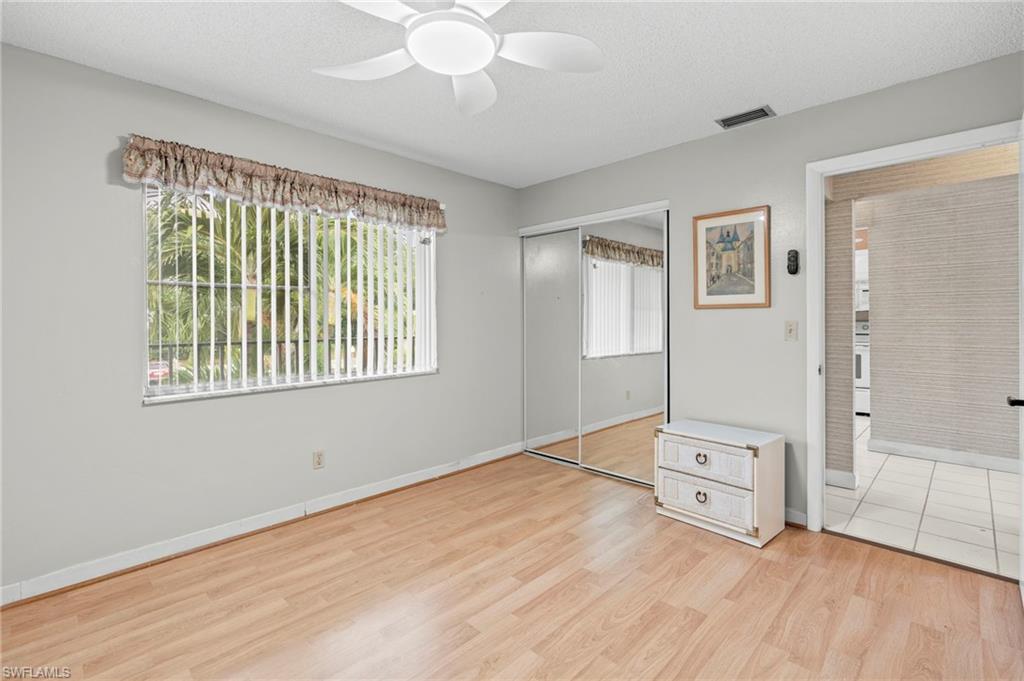 6184 Michelle Way, Unit 243 Fort Myers, FL 33919 - Photo 15 of 21 a view of livingroom with hardwood floor and window