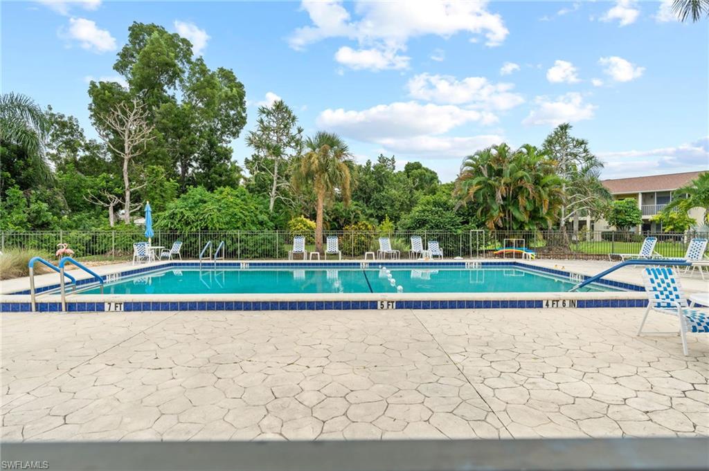 6184 Michelle Way, Unit 243 Fort Myers, FL 33919 - Photo 20 of 21 a view of a road with a yard