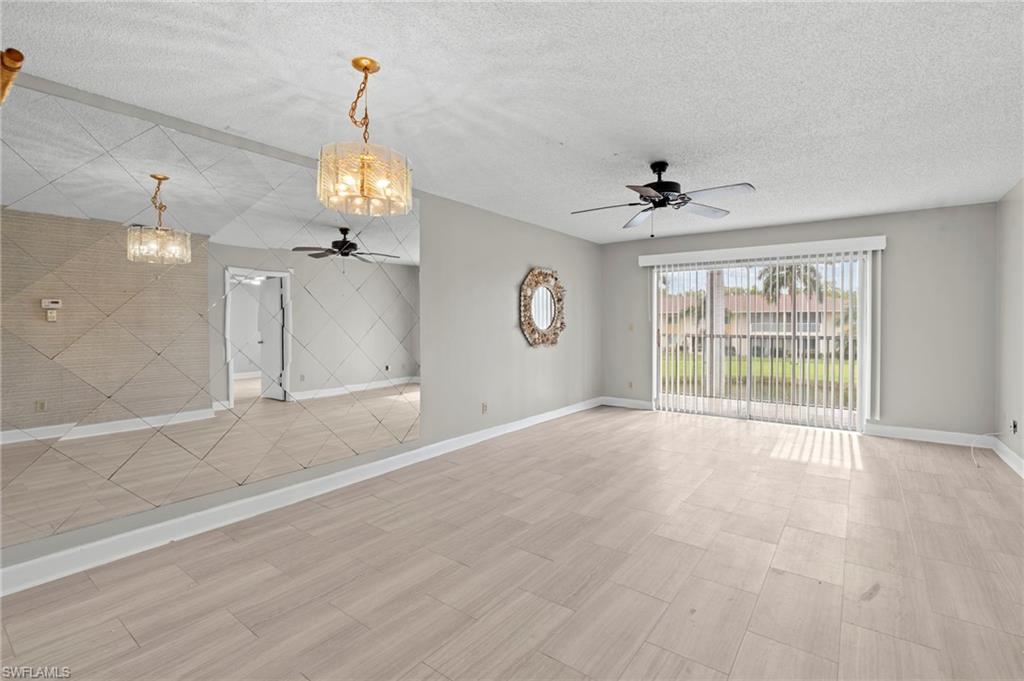 6184 Michelle Way, Unit 243 Fort Myers, FL 33919 - Photo 2 of 21 a view of an empty room with a window